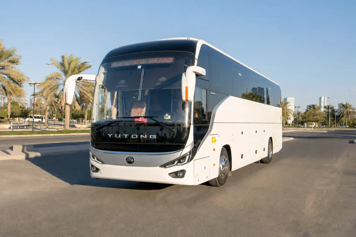 Illustrative white group coach in Dubai for a 50-seater bus with driver enquiry
