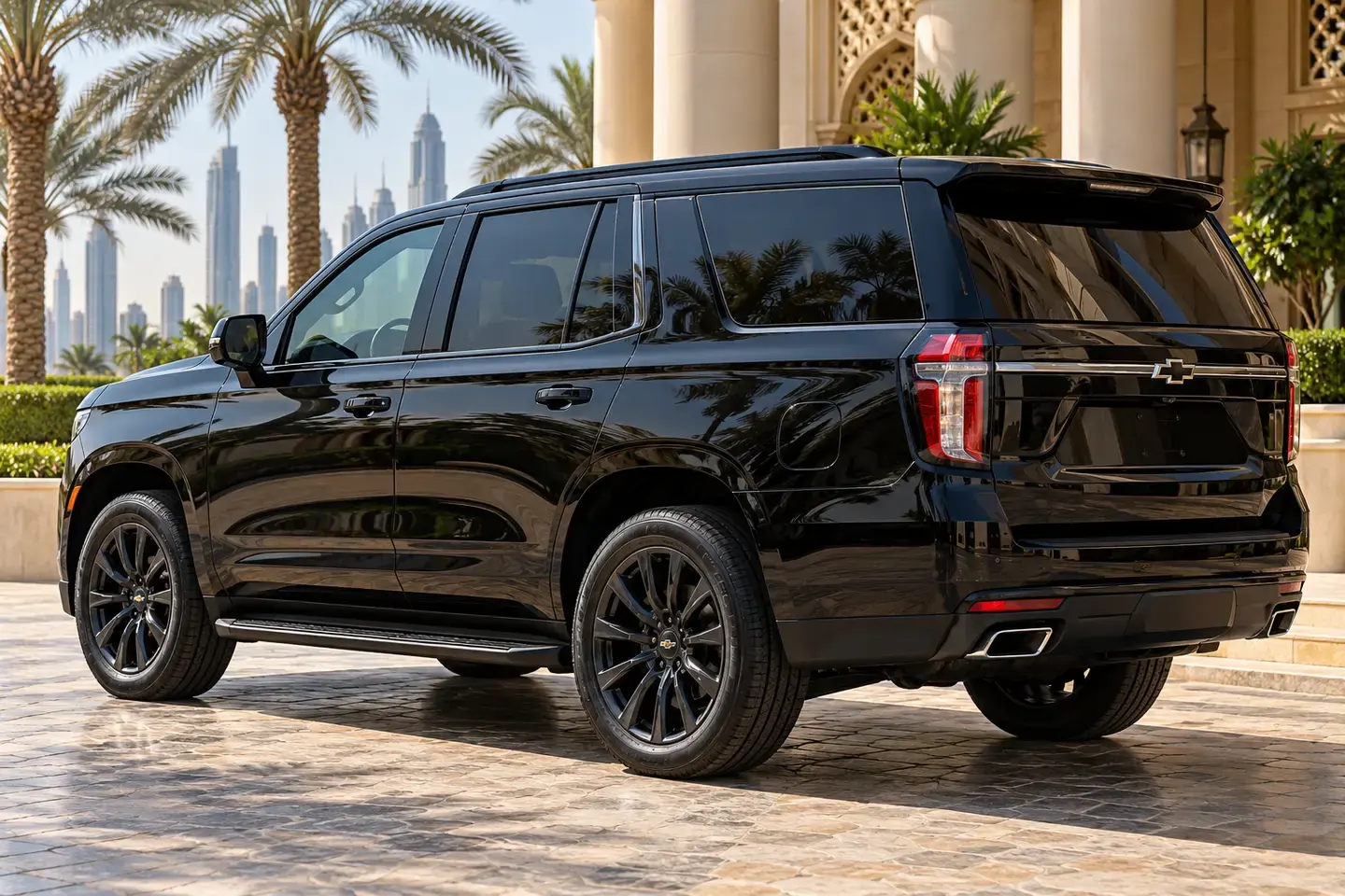 Illustrative black Chevrolet Tahoe SUV with closed doors and no registration plates at a Dubai hotel