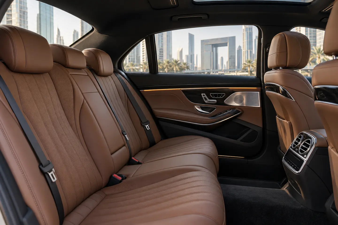 Illustrative tan leather rear passenger cabin of a standard Mercedes S-Class sedan in Dubai